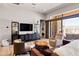Comfortable living room offering a view to the backyard patio and an open floor plan at 16134 E Ridgestone Dr, Fountain Hills, AZ 85268
