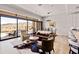 Inviting living room featuring a sliding glass doors, stylish furniture, and a serene desert view at 16134 E Ridgestone Dr, Fountain Hills, AZ 85268