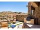 Outdoor seating area with built in barbeque and desert views at 16134 E Ridgestone Dr, Fountain Hills, AZ 85268