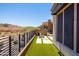 Enjoy spectacular desert views from this covered patio with artificial turf and stone at 16134 E Ridgestone Dr, Fountain Hills, AZ 85268