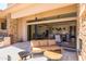 Outdoor patio area with kitchen access and plush patio furniture overlooking the yard at 16134 E Ridgestone Dr, Fountain Hills, AZ 85268