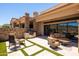 Outdoor patio with BBQ, stone accents, and outdoor seating area at 16134 E Ridgestone Dr, Fountain Hills, AZ 85268