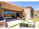 Beautiful outdoor patio with barbecue area and stone accents overlooking desert landscape at 16134 E Ridgestone Dr, Fountain Hills, AZ 85268