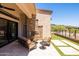 Gorgeous outdoor patio features a fireplace, barbecue, and comfortable seating at 16134 E Ridgestone Dr, Fountain Hills, AZ 85268