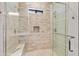 Walk-in shower featuring dual shower heads, built-in niche and bench with glass door at 16134 E Ridgestone Dr, Fountain Hills, AZ 85268