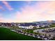 Aerial view of the community showcasing the well-maintained lawns, elegant homes, and beautiful landscaping at sunset at 17625 W Middlebury St, Surprise, AZ 85388