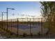 Scenic pickleball courts with lush greenery, promoting outdoor recreation and a healthy community lifestyle at 17625 W Middlebury St, Surprise, AZ 85388
