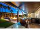 Outdoor entertaining area with a grill, bar, pergola, pool, and plenty of space for recreation at 18371 W Roma Ave, Goodyear, AZ 85395