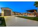 Wide backyard shot showcasing pool, putting green and parking with inviting amenities perfect for outdoor living and recreation at 18371 W Roma Ave, Goodyear, AZ 85395