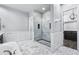 Open bathroom showcasing glass enclosed shower and custom tiling at 18371 W Roma Ave, Goodyear, AZ 85395