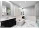 Bright bathroom with a large soaking tub, dual sinks, and custom tile flooring at 18371 W Roma Ave, Goodyear, AZ 85395