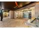 Spacious covered patio with ceiling fans, recessed lighting, and a granite countertop wet bar at 18371 W Roma Ave, Goodyear, AZ 85395