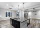 Bright and spacious kitchen with an island, granite countertops, and open floor plan is ideal for entertaining and Gathering living at 18371 W Roma Ave, Goodyear, AZ 85395