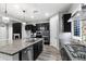 Gourmet kitchen with large island, stainless steel appliances, stone countertops, and ample storage for culinary enthusiasts at 18371 W Roma Ave, Goodyear, AZ 85395