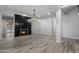 Open living area featuring modern fireplace, recessed lighting, and tile flooring, perfect for entertaining at 18371 W Roma Ave, Goodyear, AZ 85395