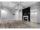 Large living room featuring fireplace, fan, recessed lights, and tile floors, offering an open, welcoming space at 18371 W Roma Ave, Goodyear, AZ 85395