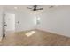 Bright bedroom features wood flooring, a modern ceiling fan and ample sunlight at 2041 W Palo Verde Dr, Phoenix, AZ 85015