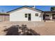 Rear exterior view of the house featuring gravel landscaping and a bright, neutral paint at 2041 W Palo Verde Dr, Phoenix, AZ 85015