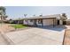 Inviting single-Gathering home with a clean white exterior, dark accents, a well-maintained lawn, and ample parking space at 2041 W Palo Verde Dr, Phoenix, AZ 85015