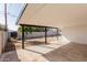 Covered patio with concrete floor and a view of the gravel backyard with block wall fence at 2041 W Palo Verde Dr, Phoenix, AZ 85015