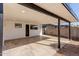 View of the spacious covered patio and access to the backyard with privacy wall at 2041 W Palo Verde Dr, Phoenix, AZ 85015