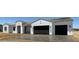 Charming single-story home with black garage doors and a tile roof at 231Xx W Gloria Ln, Wittmann, AZ 85361