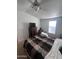 Cozy bedroom offers neutral tones, a ceiling fan, and lots of space at 2600 E Allred Ave # R-88, Mesa, AZ 85204