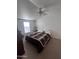 Bedroom with neutral tones, window, and ceiling fan at 2600 E Allred Ave # R-88, Mesa, AZ 85204