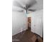 Bedroom features neutral tones, ceiling fan, and access to the laundry room at 2600 E Allred Ave # R-88, Mesa, AZ 85204