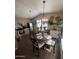 Cozy breakfast nook features a decorative light fixture and views from the window at 2600 E Allred Ave # R-88, Mesa, AZ 85204