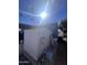 Mobile home with storage shed, covered parking, and mature palm trees at 2600 E Allred Ave # R-88, Mesa, AZ 85204