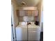 Laundry room with white washer and dryer, storage shelf, and window at 2600 E Allred Ave # R-88, Mesa, AZ 85204