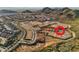 Stunning aerial view of the community nestled in the foothills of the mountains with available lots at 27366 N 69Th Dr, Peoria, AZ 85383