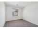 Clean bedroom includes a window, neutral walls, and carpeted floors at 2947 N Evergreen St, Buckeye, AZ 85396