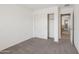 Secondary bedroom with sliding closet doors for ample storage and neutral decor at 2947 N Evergreen St, Buckeye, AZ 85396