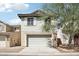 Charming two-story home featuring an attached garage and inviting curb appeal at 2947 N Evergreen St, Buckeye, AZ 85396