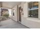 Inviting front porch featuring decorative lighting, shuttered windows, and a well-maintained facade at 2947 N Evergreen St, Buckeye, AZ 85396