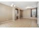 Open-concept living room with tile floors and a seamless transition to the staircase at 2947 N Evergreen St, Buckeye, AZ 85396