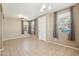 Bright living room with tile flooring, neutral walls, and ample natural light from large windows at 2947 N Evergreen St, Buckeye, AZ 85396