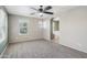 Large main bedroom offers a ceiling fan and an arched doorway leading to the main bath at 2947 N Evergreen St, Buckeye, AZ 85396