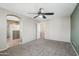Large main bedroom offers a ceiling fan and an arched doorway leading to the main bath at 2947 N Evergreen St, Buckeye, AZ 85396