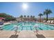 Bright community pool with swimming lanes, lush landscaping and resort-style lounge chairs at 2947 N Evergreen St, Buckeye, AZ 85396