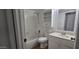 Clean, compact bathroom featuring tiled walls, storage cabinet, and shower-tub combination at 3131 W Cochise Dr # 256, Phoenix, AZ 85051