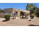 Community picnic area featuring an umbrella-covered table and grill, providing a relaxing outdoor experience at 3131 W Cochise Dr # 256, Phoenix, AZ 85051