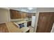 Cozy kitchen with ample cabinet space, white appliances, and laminate countertops at 3131 W Cochise Dr # 256, Phoenix, AZ 85051
