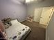 This bedroom features neutral walls, ceiling fan, and closet at 330 W Evergreen Pear Ave, Queen Creek, AZ 85140