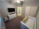 This bedroom features neutral walls, ceiling fan, and closet at 330 W Evergreen Pear Ave, Queen Creek, AZ 85140