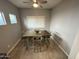 Cozy dining area with natural light, wood-look tile floors and neutral paint at 330 W Evergreen Pear Ave, Queen Creek, AZ 85140