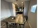Comfortable dining space with modern decor, neutral colors and wood-look flooring at 330 W Evergreen Pear Ave, Queen Creek, AZ 85140