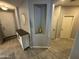 Welcoming entryway with a decorative niche, wood-look tile flooring and view to other rooms at 330 W Evergreen Pear Ave, Queen Creek, AZ 85140